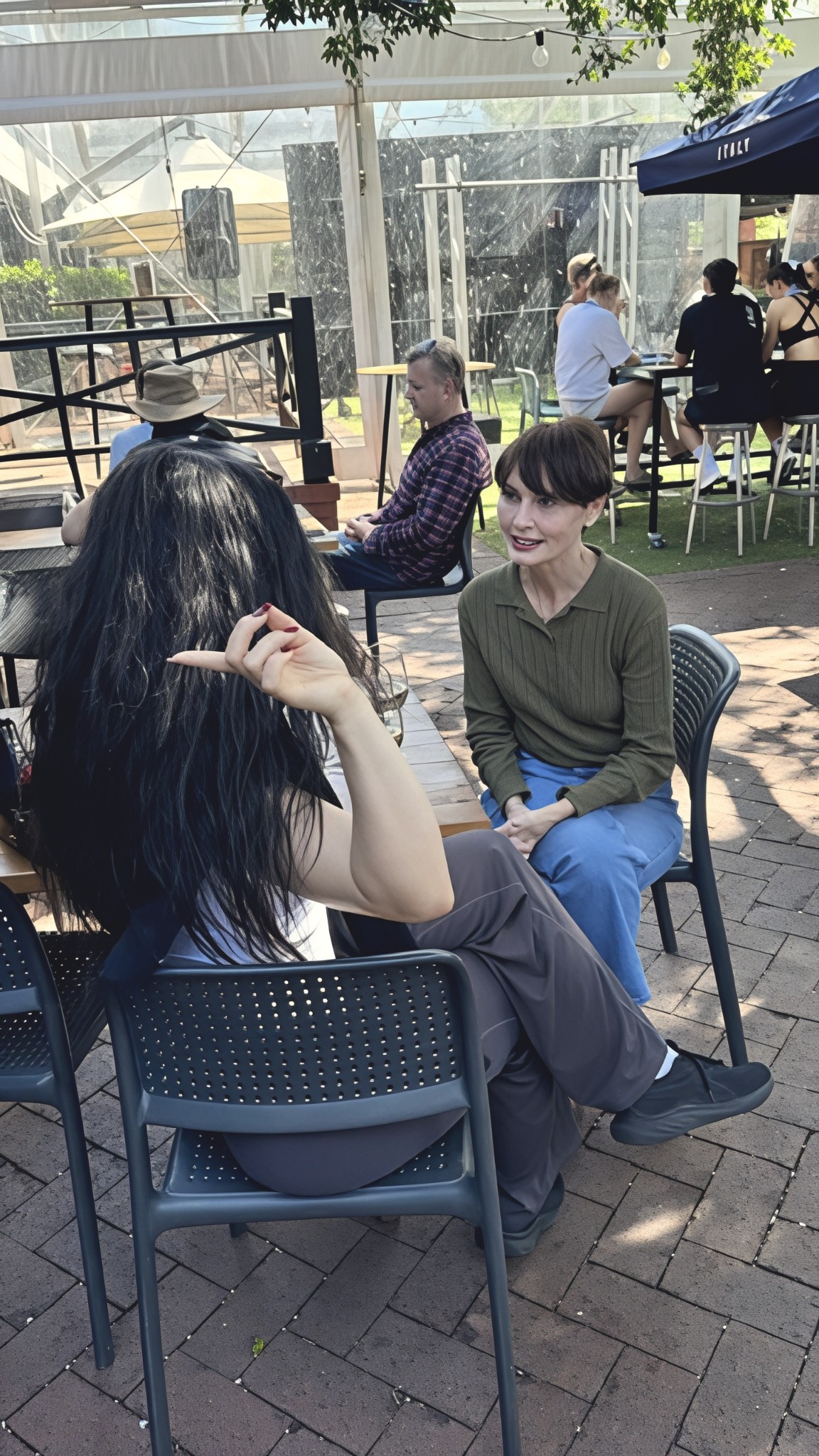 Adriana speaking with a local resident at a community gathering